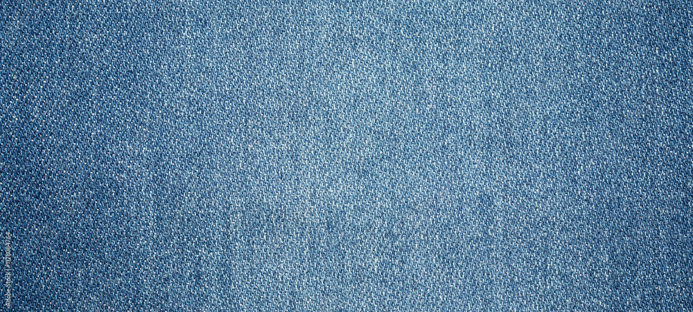 Old denim blue jeans fabric texture background Old denim blue jeans fabric texture background