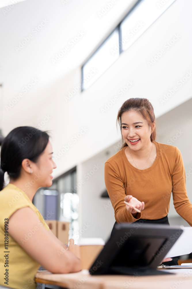 Two female collegues meeting and discussing about job in office. Two female collegues meeting and discussing about job in office.