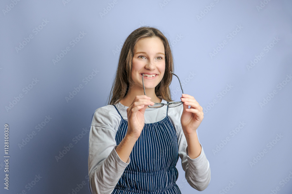 adorable smiling child looking at camera in eyeglasses