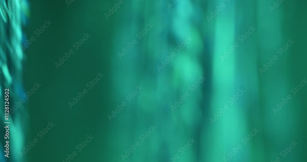 Defocused tinsel. Festive strings. Party bright color threads shine in happy lighting. Twinkling foil ribbons hang sparkling reflection.