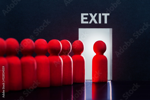 Large layoffs of employees. Wooden figures of people going to the exit.