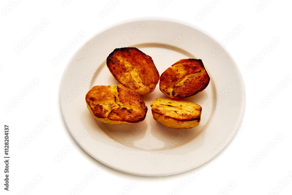 A plate of four baked potatoes with a crispy crust A plate of four baked potatoes with a crispy crust