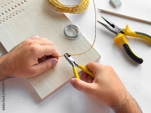 Crafting with precision. Hand tools and wire for diy projects photo