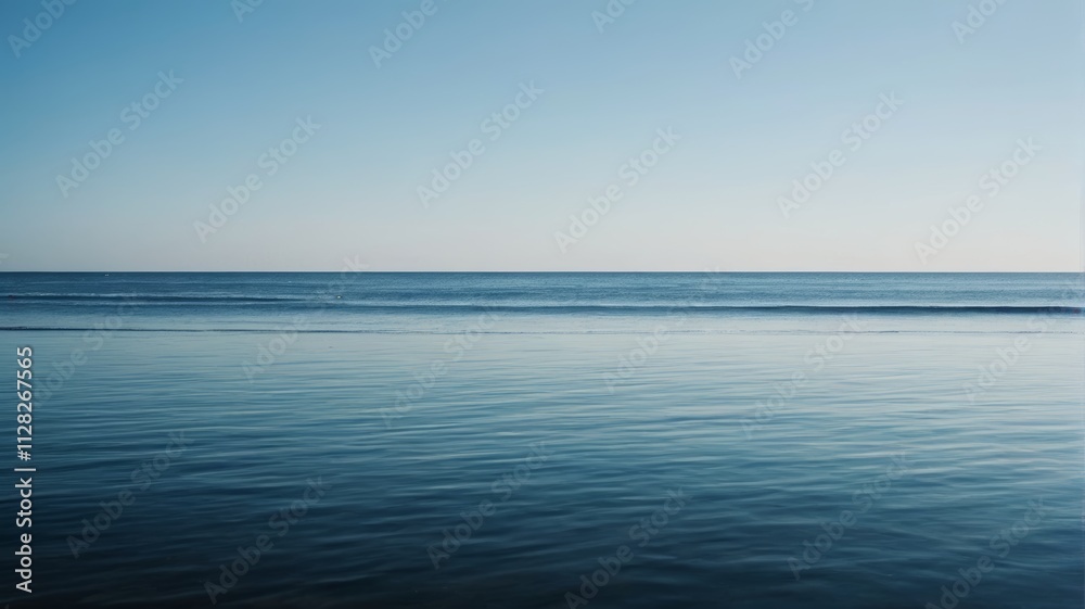 a person standing on the beach looking out at the ocean a person standing on the beach looking out at the ocean