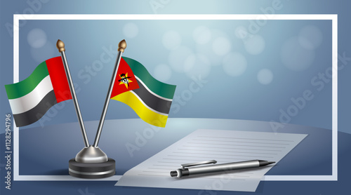 United Arab Emirate and Mozambique National flags on small table with bokeh background, cooperative relationship