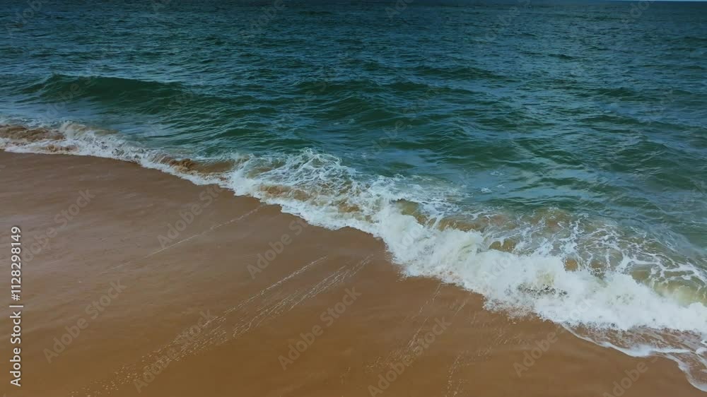 Beautiful sea summer landscape, Waves sea water surface High quality video Bird's eye view,Drone top view waves crashing on sand beach Beautiful sea summer landscape, Waves sea water surface High quality video Bird's eye view,Drone top view waves crashing on sand beach