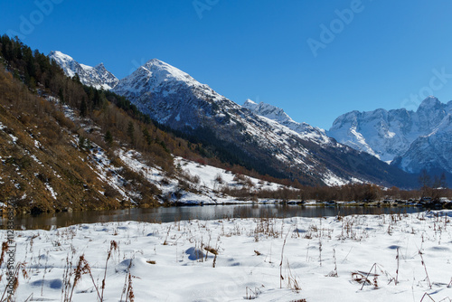 Landscape with Lake Tumanly-Gel or Tumanly-Kol (Foggy Lake) in valley of Gonachkhir River in Teberdinsky National Park. Dombay, Karachay-Cherkessia, Russia photo