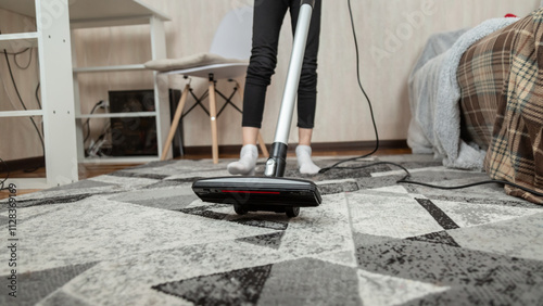 Wallpaper Mural Low section of girl cleaning floor with vacuum cleaner at home Torontodigital.ca