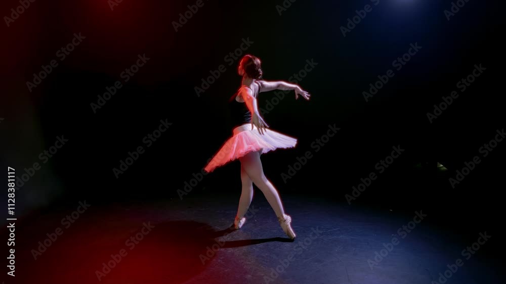 Classical ballet, beautiful woman in white tutu dancing slowly alone in studio. Grace and beauty of talented ballerina, graceful and strong female body, pretty lady in white tutu and pointe shoes Classical ballet, beautiful woman in white tutu dancing slowly alone in studio. Grace and beauty of talented ballerina, graceful and strong female body, pretty lady in white tutu and pointe shoes