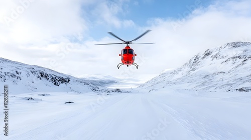 Rescue Helicopter Hovering Over Snowy Mountain Peaks During Crucial Winter Rescue Mission in Remote Mountainous Terrain photo