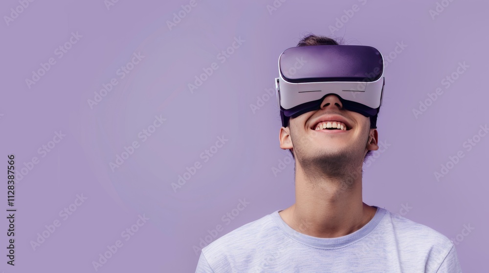 A young man wearing opaque virtual reality goggles, with a shocked expression