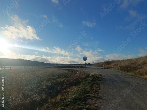 Completed road in Motiekaicio street. New road in Siaulai. Finished road in suburbs. Fields at side. Baigta gatve Motiekaicio gatveje Siauliuose. photo