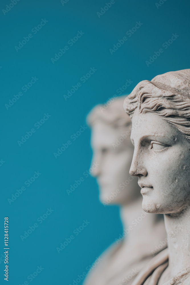 Elegant Marble Statues: Capturing the Timeless Grace and Beauty of Classical Sculpture against a Rich Blue Background Elegant Marble Statues: Capturing the Timeless Grace and Beauty of Classical Sculpture against a Rich Blue Background