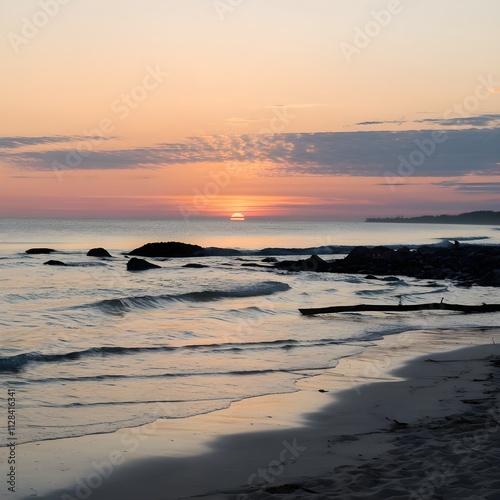 Tranquil Sunrise Over a Rocky Beach with Gentle Waves