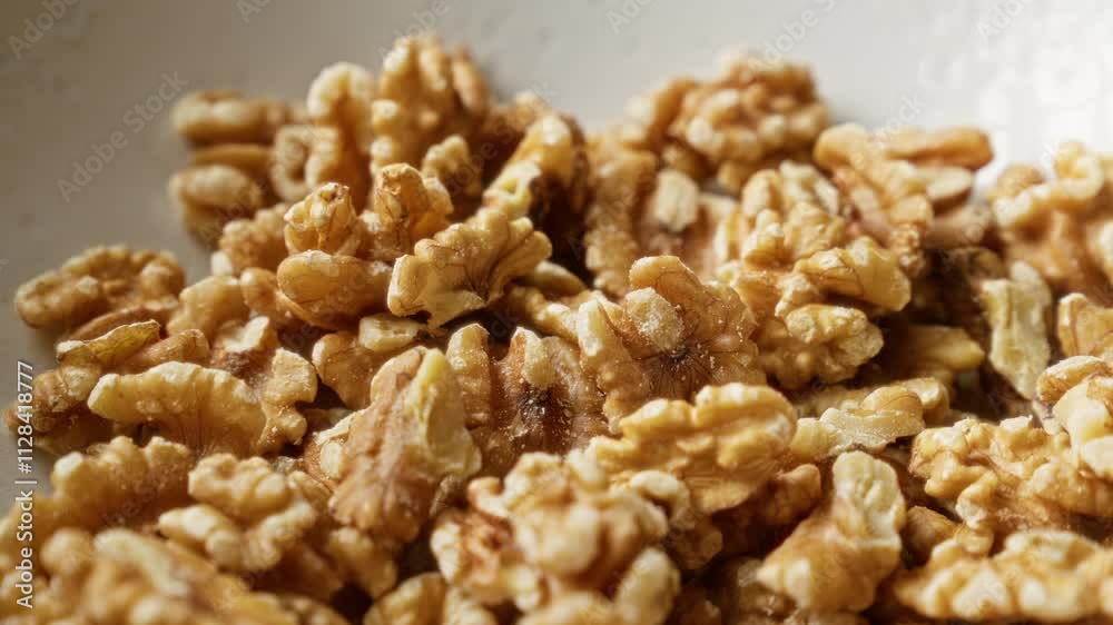 Fresh walnuts piled in a close-up shot, highlighting their texture and natural patterns, perfect for themes of healthy snacks and natural food. Fresh walnuts piled in a close-up shot, highlighting their texture and natural patterns, perfect for themes of healthy snacks and natural food.