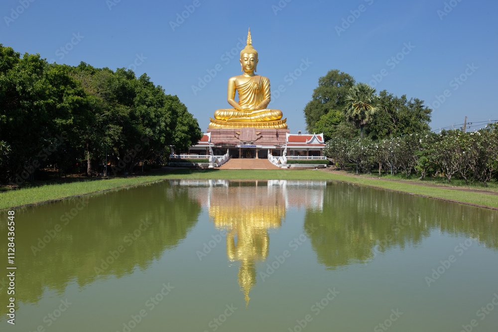 Beautiful big Golden Buddha statue under clear and sunny sky in Khueang Nai District, Ubon Ratchathani, Thailand Beautiful big Golden Buddha statue under clear and sunny sky in Khueang Nai District, Ubon Ratchathani, Thailand