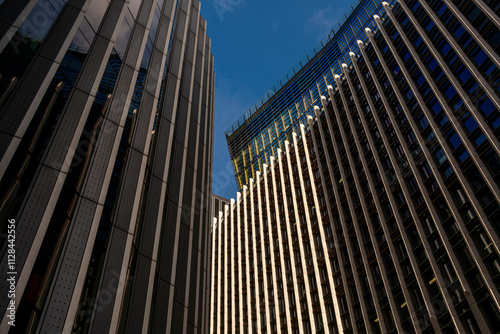 This image illustrates a striking pattern of modern buildings with intersecting lines and forms, showcasing the unique characteristics of contemporary architectural design. photo