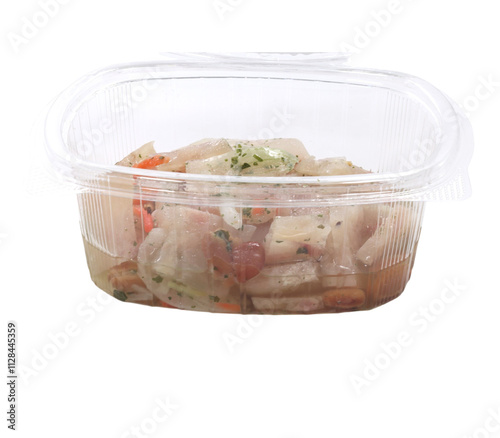 Plastic container holding herring salad on transparent background