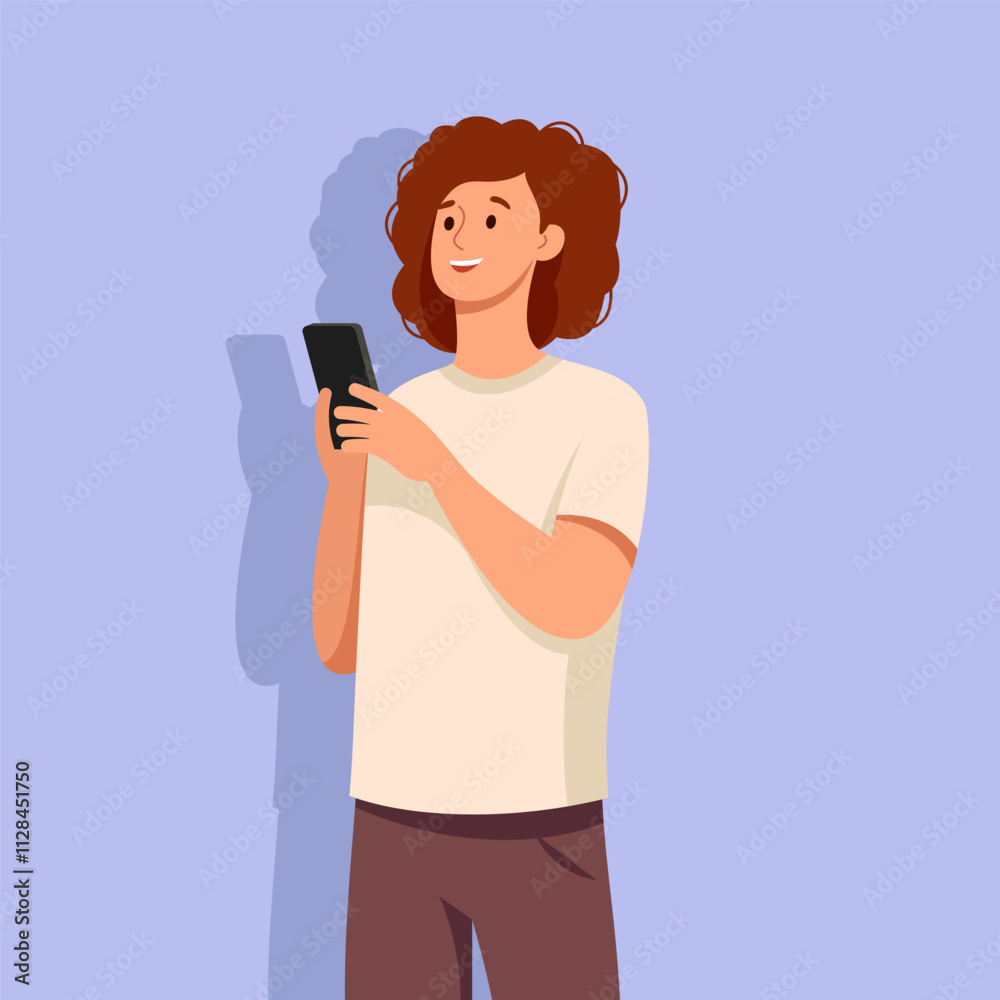A young woman with curly brown hair smiles and holds a black smartphone. She is wearing a white T-shirt and brown pants. A young woman with curly brown hair smiles and holds a black smartphone. She is wearing a white T-shirt and brown pants.