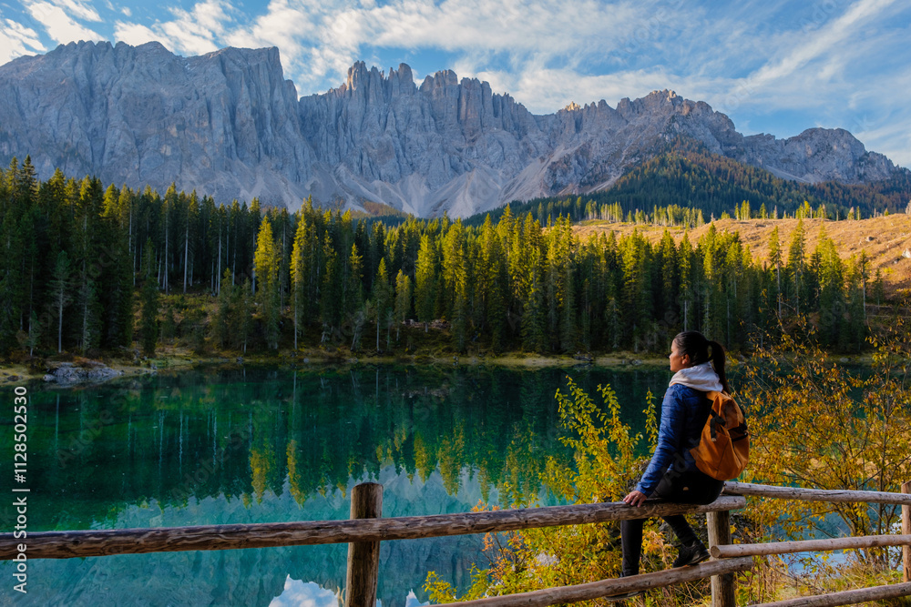 Naklejka premium Enjoying the serene beauty of Dolomites' lakeside in Italy during a tranquil afternoon