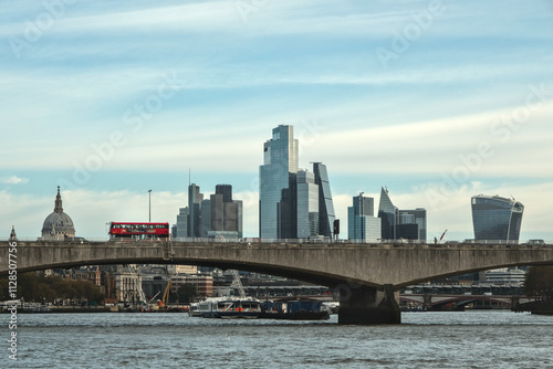 View from a boat of Waterloo Bridge, and London's modern architecture. A double-decker bus passes over this bridge, London. photo