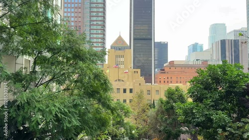 Panning reveal of Los Angeles' central skyline with a view of the iconic Public Library photo