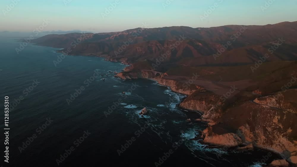 Big Sur California sunset scenic vista aerial drone Santa Lucia Mountains rugged coastline Silcone Valley Bixby Big Creek Pfeiffer Bridge Canyon Pacific Ocean Apple Computer screensaver circle right