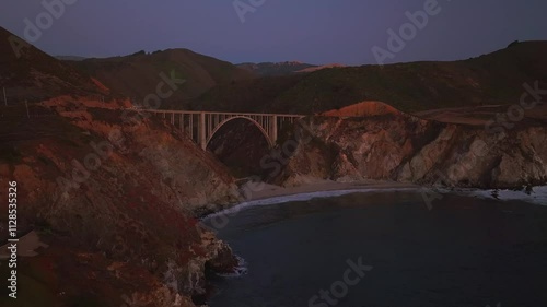 Bixby Bridge Big Creek Pfeiffer Canyon Santa Lucia Mountains Big Sur California aerial drone stunning sunset Pacific Ocean Coastal Highway windy road rugged coastline waves crashing forward motion photo