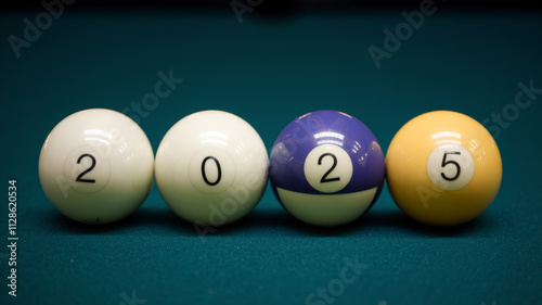 four colorful billiard balls with numbers 2025 neatly aligned on a vibrant green table cloth, symbolizing a new year concept photo