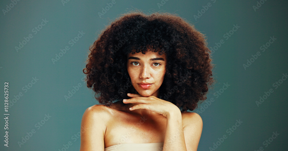 Portrait, growth or woman with afro hair care, studio and treatment for wellness or health. Face, shampoo or confident girl model with beauty, volume or natural texture on green background in Brazil Portrait, growth or woman with afro hair care, studio and treatment for wellness or health. Face, shampoo or confident girl model with beauty, volume or natural texture on green background in Brazil