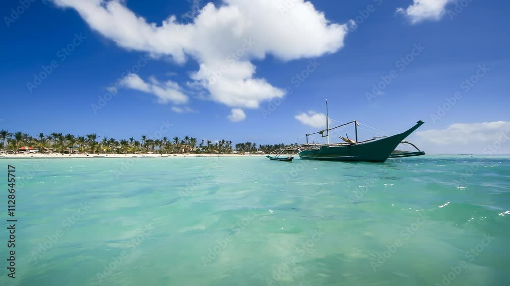 Bangka boat at a beautiful tropical sandy beach Bangka boat at a beautiful tropical sandy beach