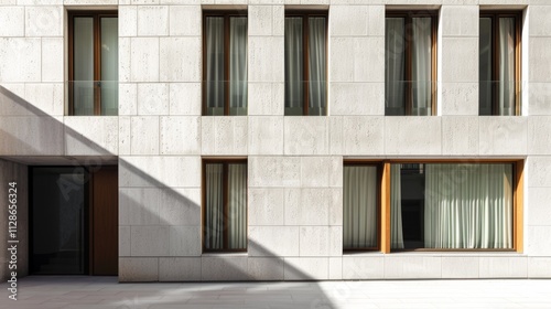Obraz na płótnie Minimalist Parisian architecture, modern building, facing a wall with windows and doors, sunny afternoon light, peaceful urban setting, no people present. w salonie