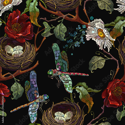 Red roses, white chamomile flowers, bird nest and colorful dragonflies. Embroidery art style. Fashion summer floral template for clothes, t-shirt design. Seamless pattern