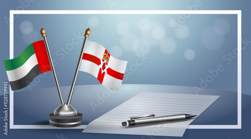 United Arab Emirate and Northern Ireland National flags on small table with bokeh background, cooperative relationship