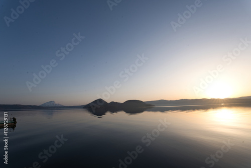 洞爺湖の中島と夕焼けの青空と雪の残る羊蹄山