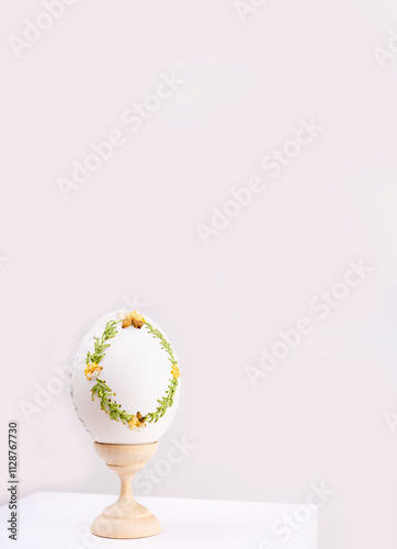 Happy Easter. Table decorated with colorful Easter eggs in straw. Easter decoration. Easter tradition