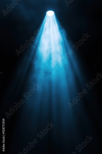 Bright stage light illuminates smoky mist. Fog creates ethereal glow on black background. God’s beams radiate with magical atmosphere.