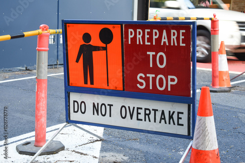 Prepare to stop, do not overtake sign on a road with road works