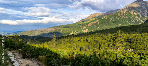 Hiking in the mountains as a favorite hobby. Active lifestyle. Views of the Tatra Mountains and Western Tatras from hiking trails. Mountain peaks, slopes and valleys between mountains