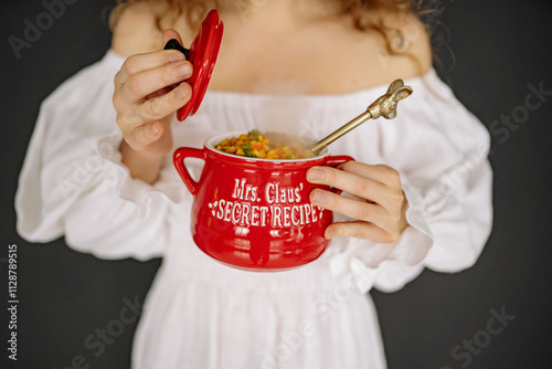 Φωτογραφία Holiday cooking with Mrs Claus secret recipe pot filled with festive ingredients