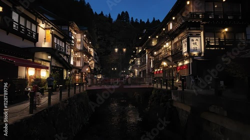 Ginzan onsen, Yamagata, Japan, Scenic riverside village illuminated at night.