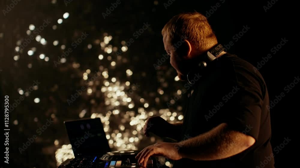 Dj mixing music on turntables, surrounded by pulsating lights. The lively atmosphere embodies the thrill of nightlife and the energy of a captivating live performance Dj mixing music on turntables, surrounded by pulsating lights. The lively atmosphere embodies the thrill of nightlife and the energy of a captivating live performance