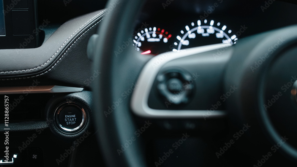 Fototapeta premium Interior of a modern car with a start button. Concept of comfort, innovative technology, and stylish design for driver convenience.