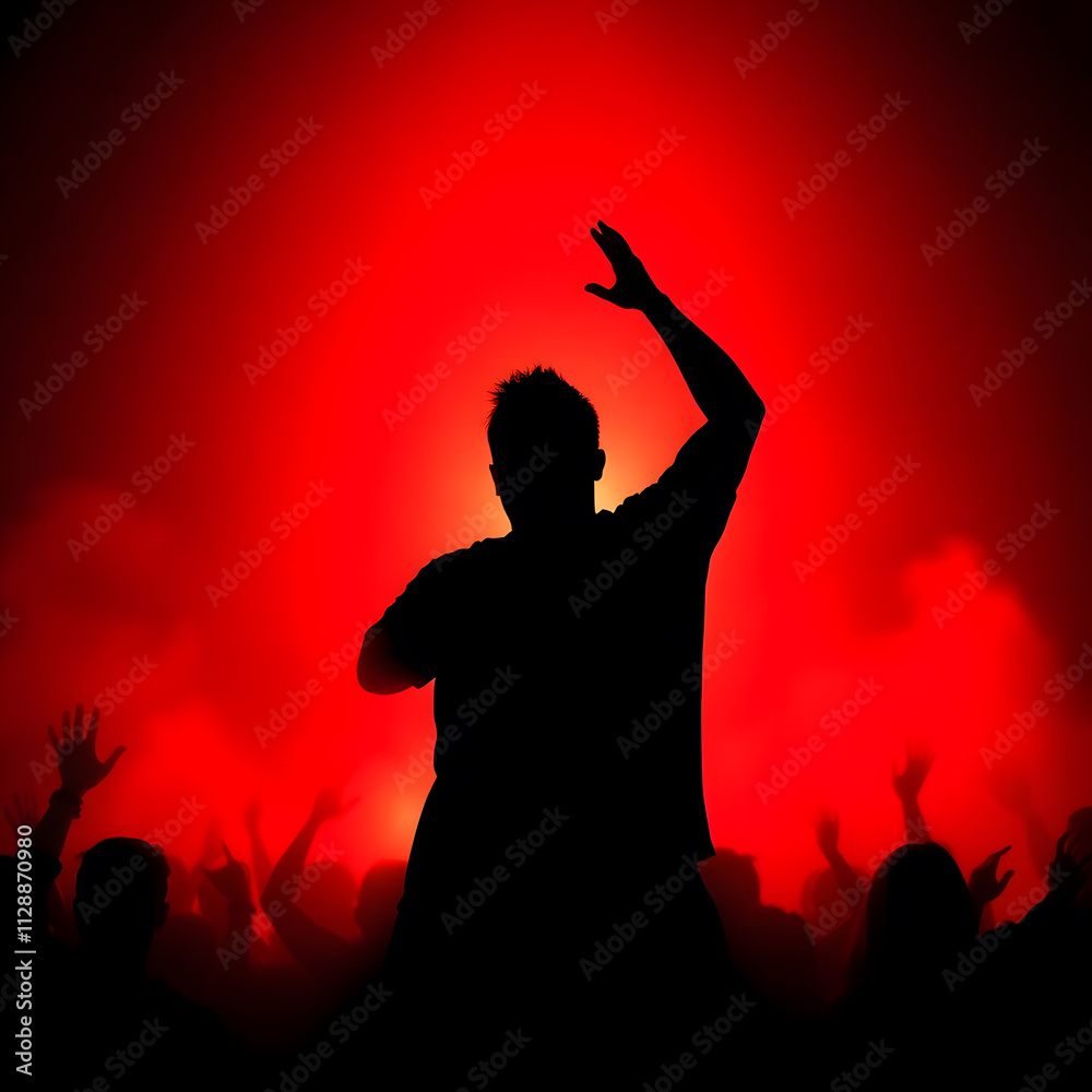 a man with his arms up in the air with a red background. a man with his arms up in the air with a red background.