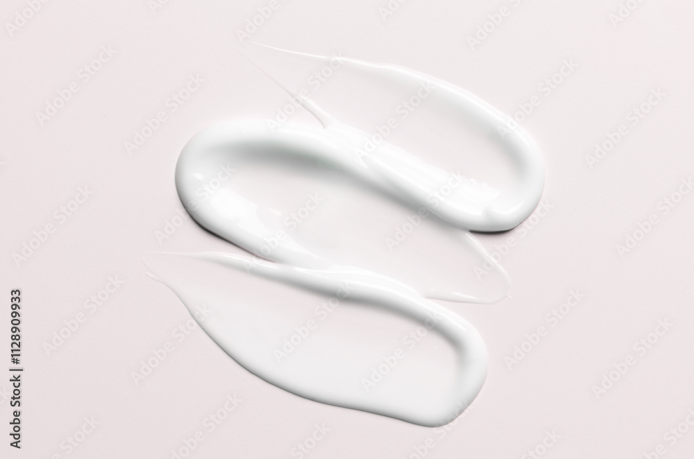A sample of a white moisturizing cosmetic cream for the body or face A sample of a white moisturizing cosmetic cream for the body or face