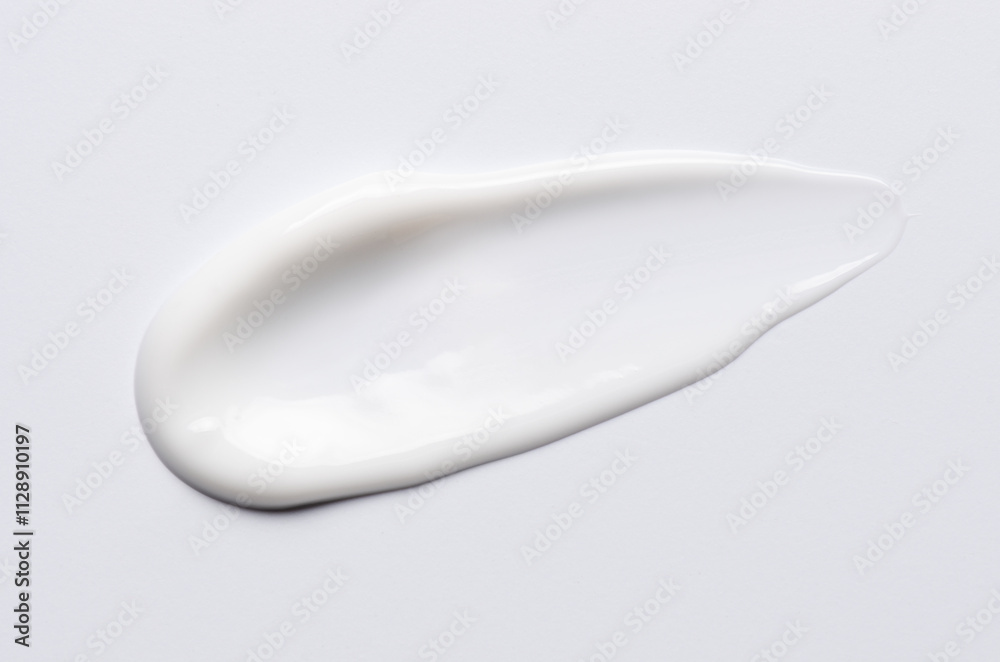 A sample of a white moisturizing cosmetic cream for the body or face A sample of a white moisturizing cosmetic cream for the body or face