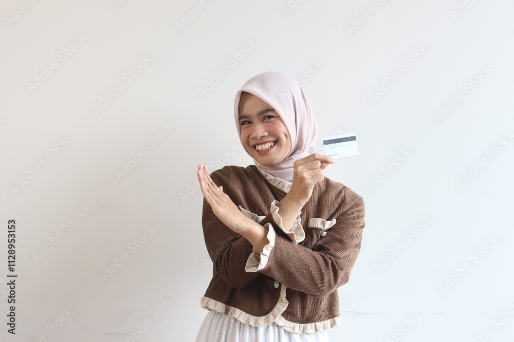 Smiling Woman in Hijab Holding Credit Card, Online Shopping, E-commerce, Happy Customer, Digital Payment, Modern Lifestyle, Financial Freedom Smiling Woman in Hijab Holding Credit Card, Online Shopping, E-commerce, Happy Customer, Digital Payment, Modern Lifestyle, Financial Freedom