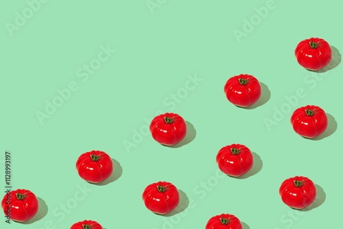 Creative pattern made of fresh raw red tomatos on pastel  background. Healthy food concept.