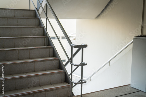 Cuadro en lienzo Building apartment stairway with handrail, using for emergency escape route