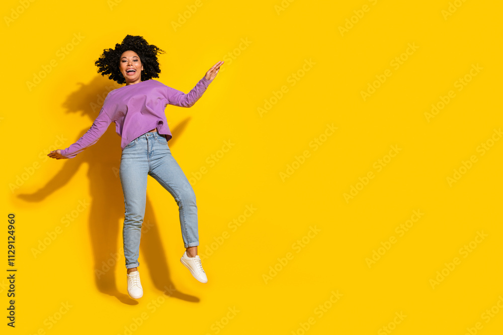 Full size photo of nice young woman jump empty space isolated on yellow color background Full size photo of nice young woman jump empty space isolated on yellow color background